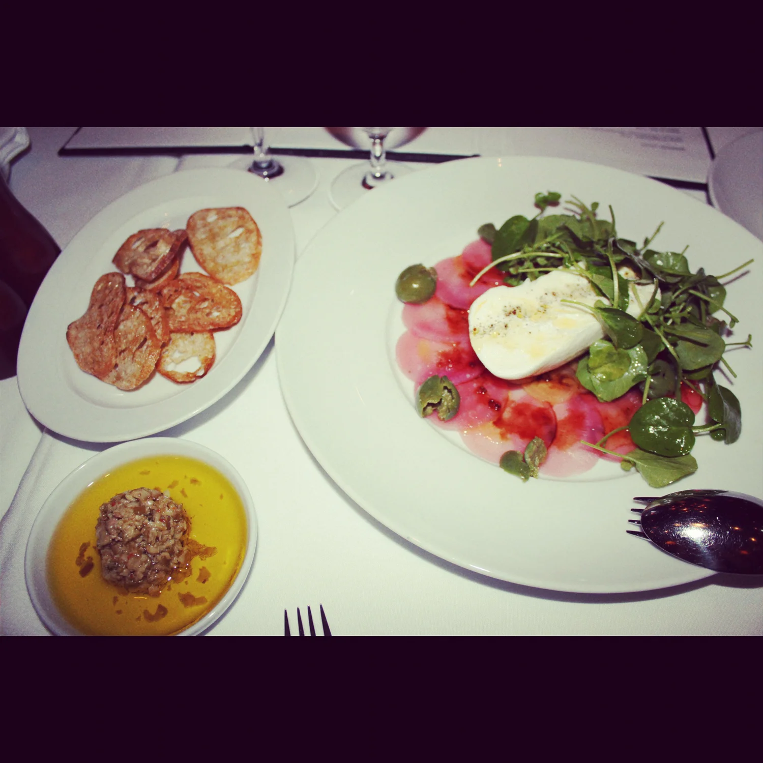 Burrata with a beet carpaccio, housemade olive tapenade, at Cin Cin.