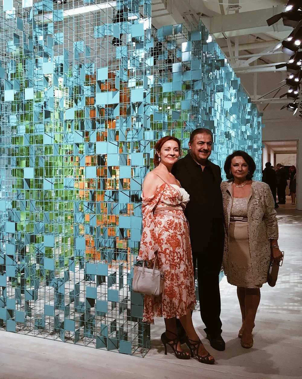 Artist Rashid Khalifa posing with guests in front of his colourful maze. / Photo: Eileen Hsieh