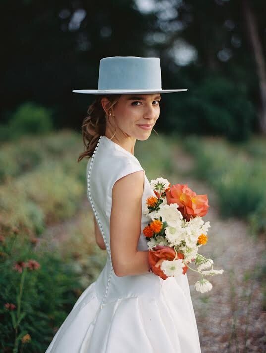 Blue hat bride with bouquet.jpg