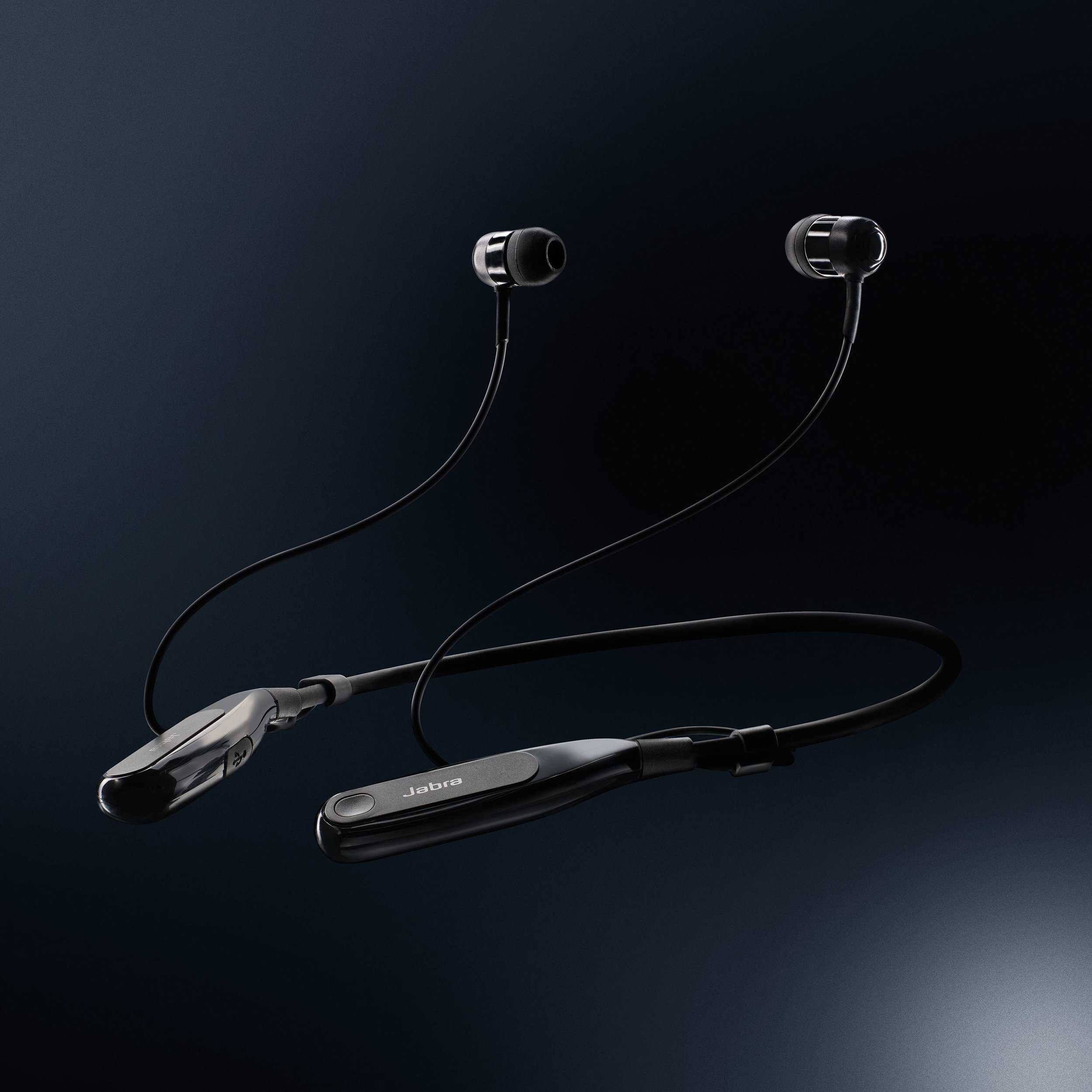 Clean product retouch of Jabra wireless earbuds on a dark gradient backdrop, emphasising contrast, product design and finish.