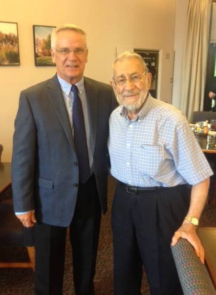 Jim (on right) with the new director of White House, Bill Schmitt.