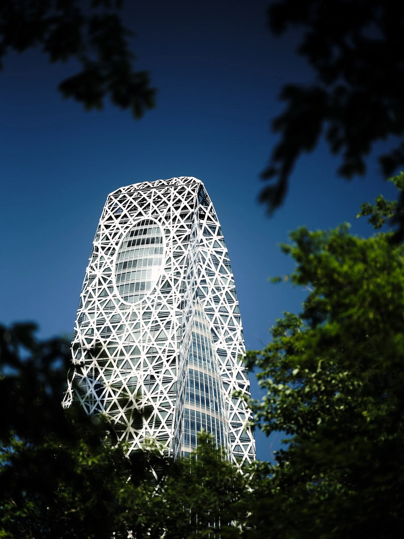 Mode Gakuen Cocoon Tower with its white lattice facade, Shinjuku, Tokyo, Japan