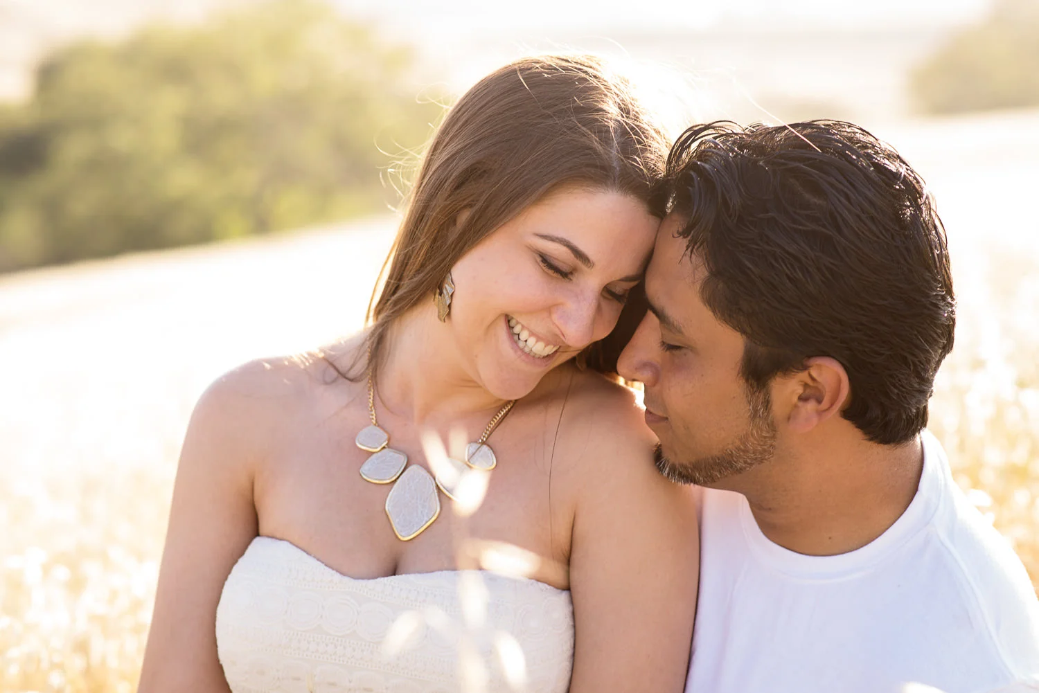 f27-photography-ventura-county-thousand-oaks-engagement-golden-field-smiling-together.jpg