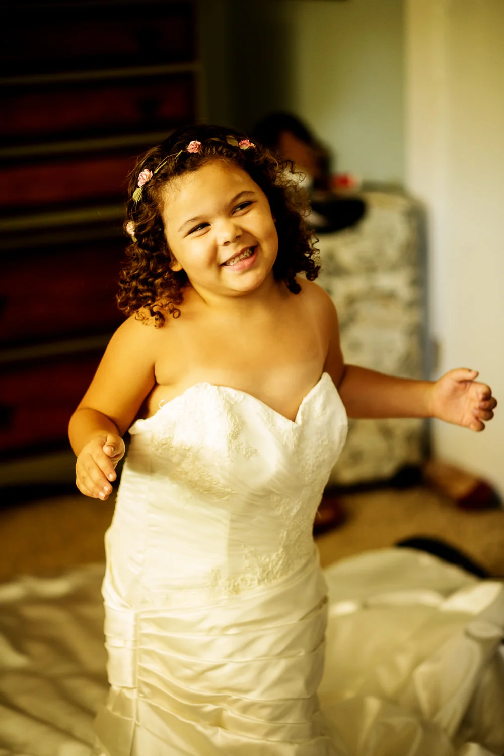 f27-Photography-Ojai-Wedding-February-2014-Flower-Girl-Trying-On-The-Wedding-Dress.jpg