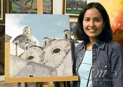 Michelle with her painting at the Exhibit.