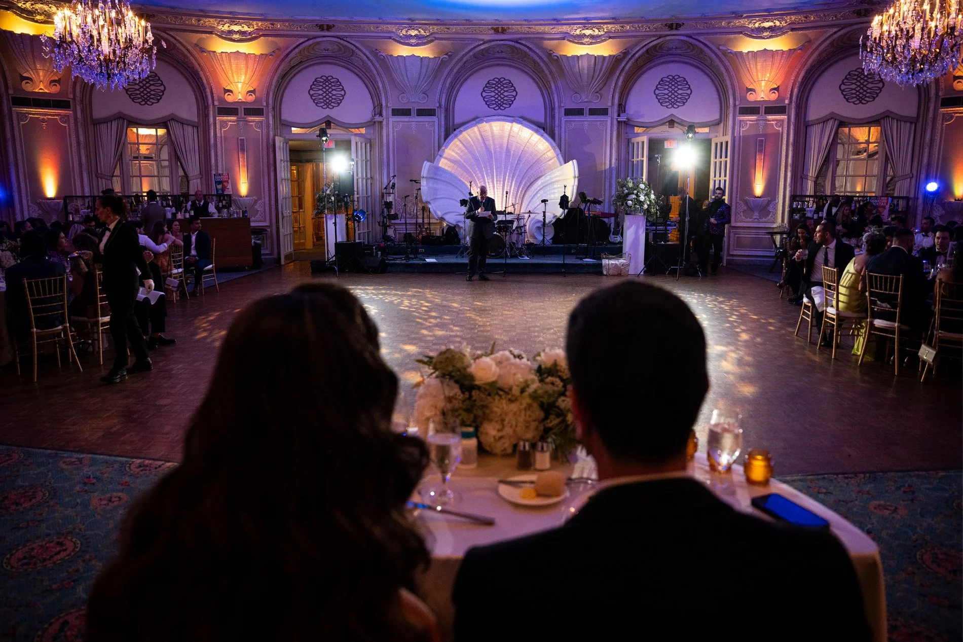 A couple listens to a toast during their documentary style wedding photography session at Fairmont Copley Plaza Hotel.