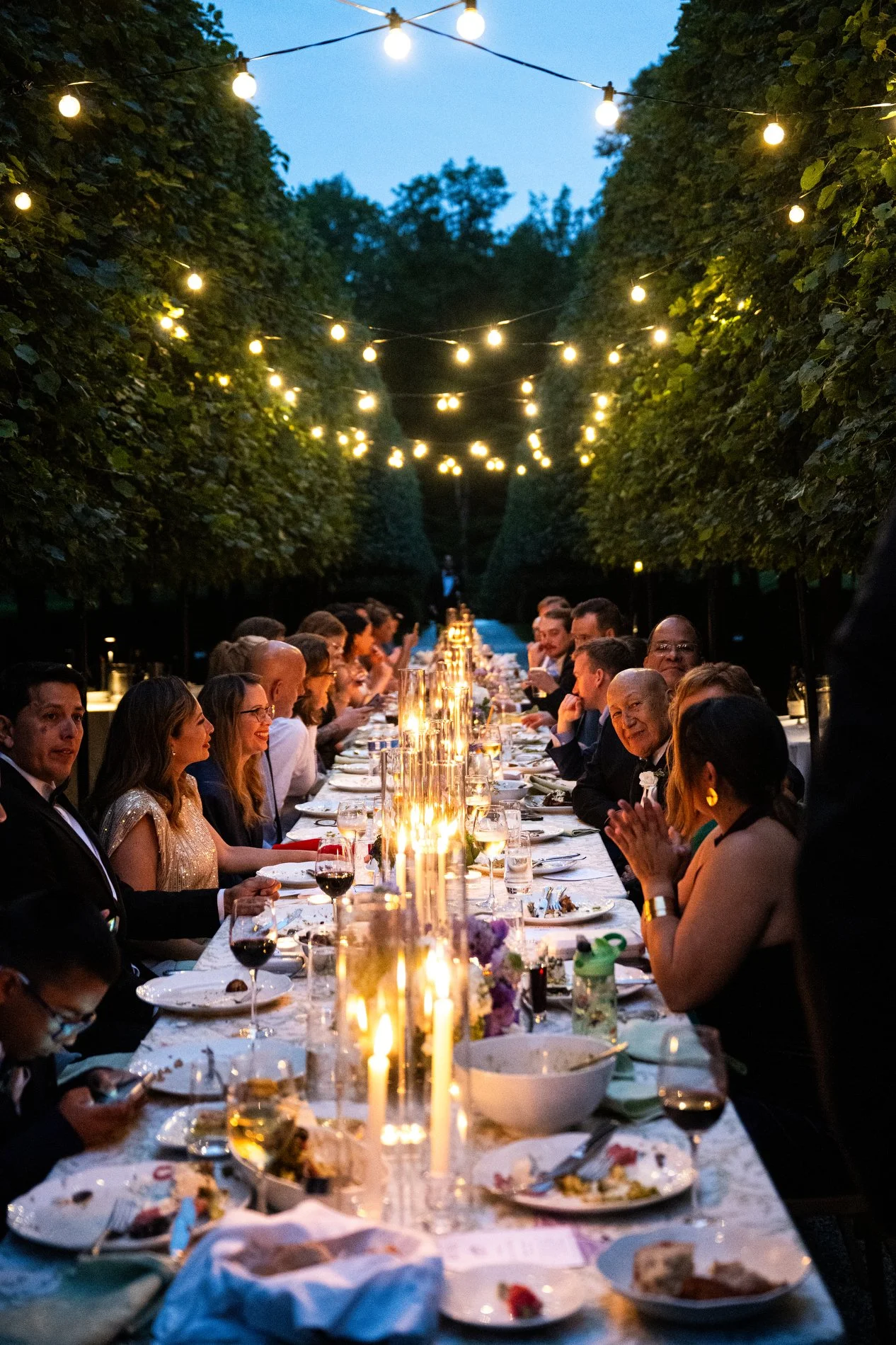 A romantic intimate dinner at long tables during a microwedding at The Mount in the Berkshires.