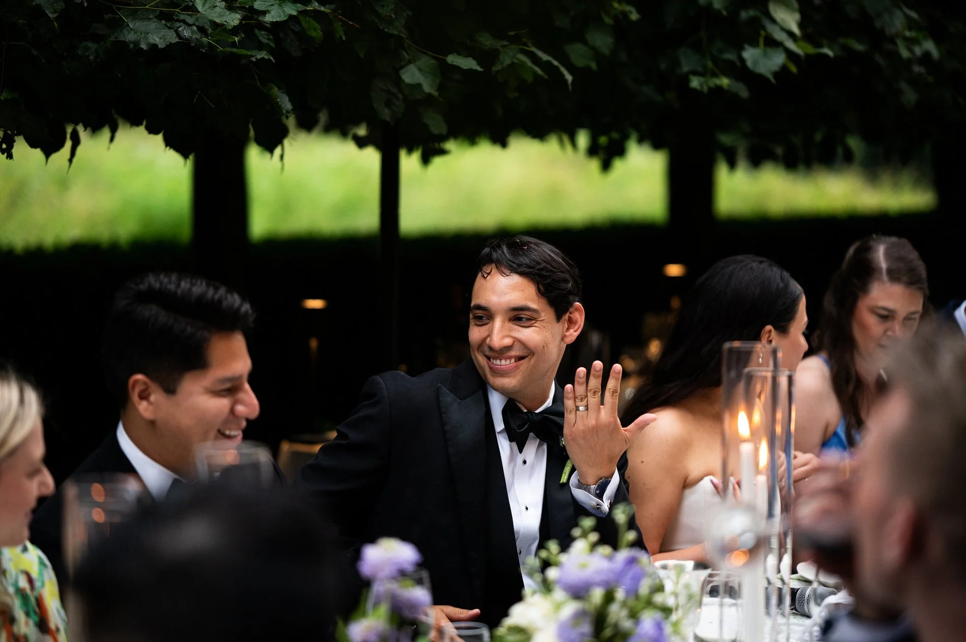 A groom shows off his new wedding ring during his microwedding at The Mount.