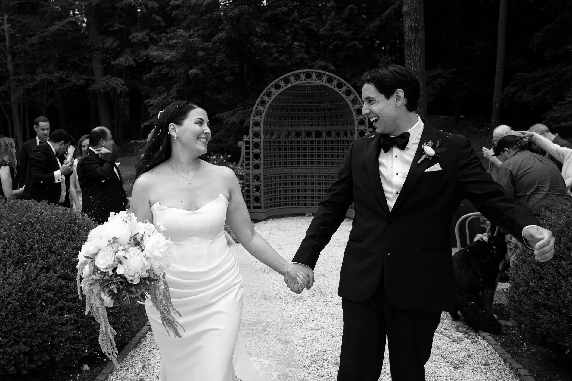 A couple walks down the aisle together after their wedding ceremony at The Mount in Lenox, Massachusetts.