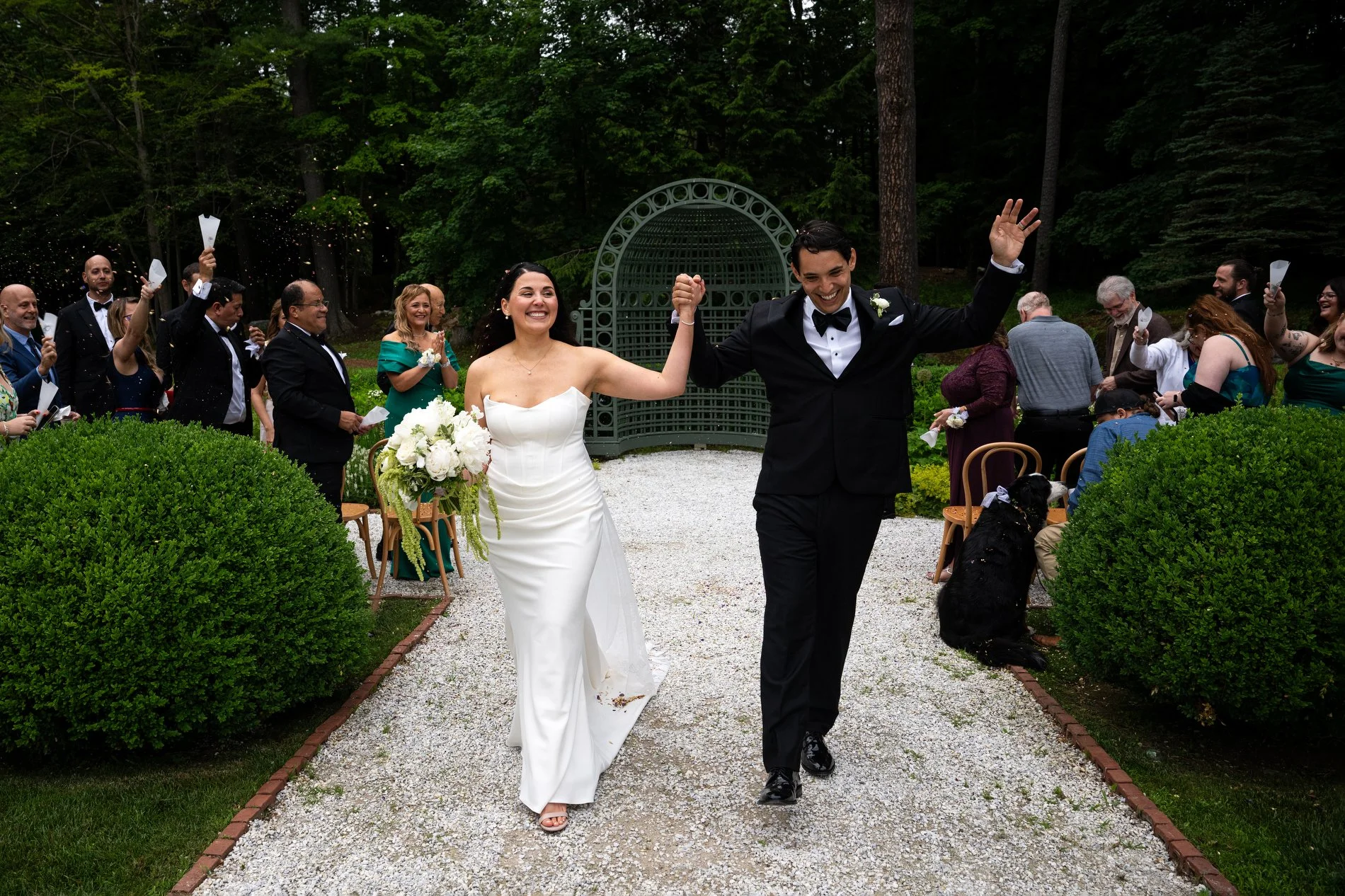A couple walks down the aisle together after their wedding ceremony at The Mount in Lenox, Massachusetts.