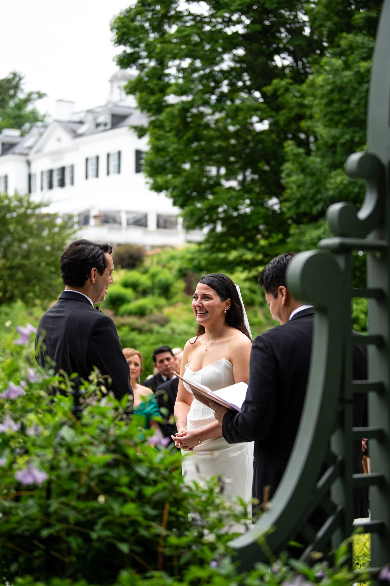 A bride laughs during her wedding ceremony at The Mount in Lenox, Massachusetts.