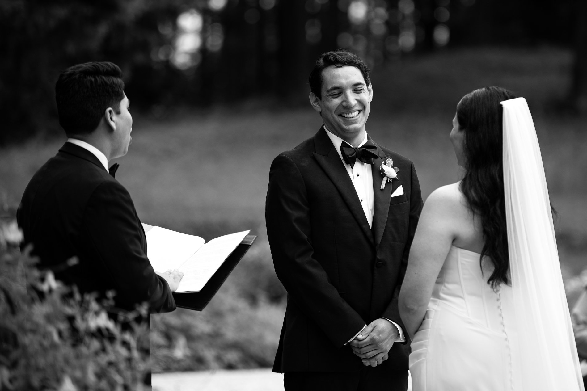A groom laughs during his wedding ceremony at The Mount in Lenox, Massachusetts.