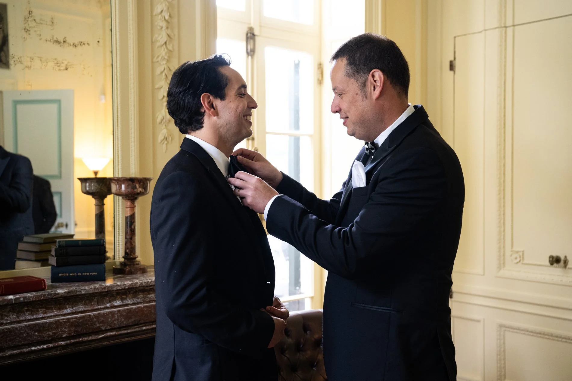 A groom gets dressed at The Mount in Lenox, Massachusetts.
