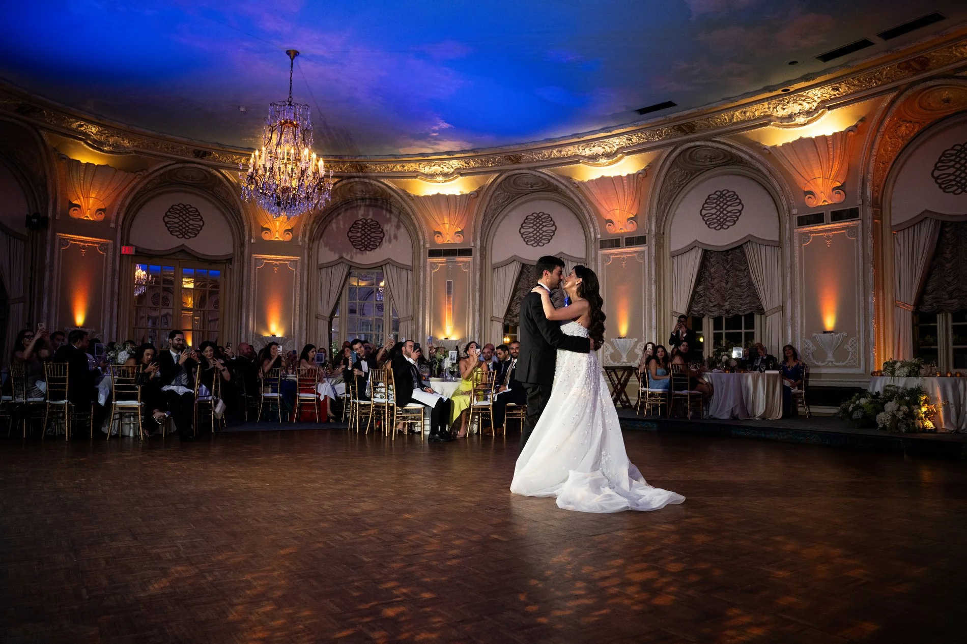 A couple dances their first dance during their Boston wedding photojournalism session at Fairmont Copley Plaza Hotel.