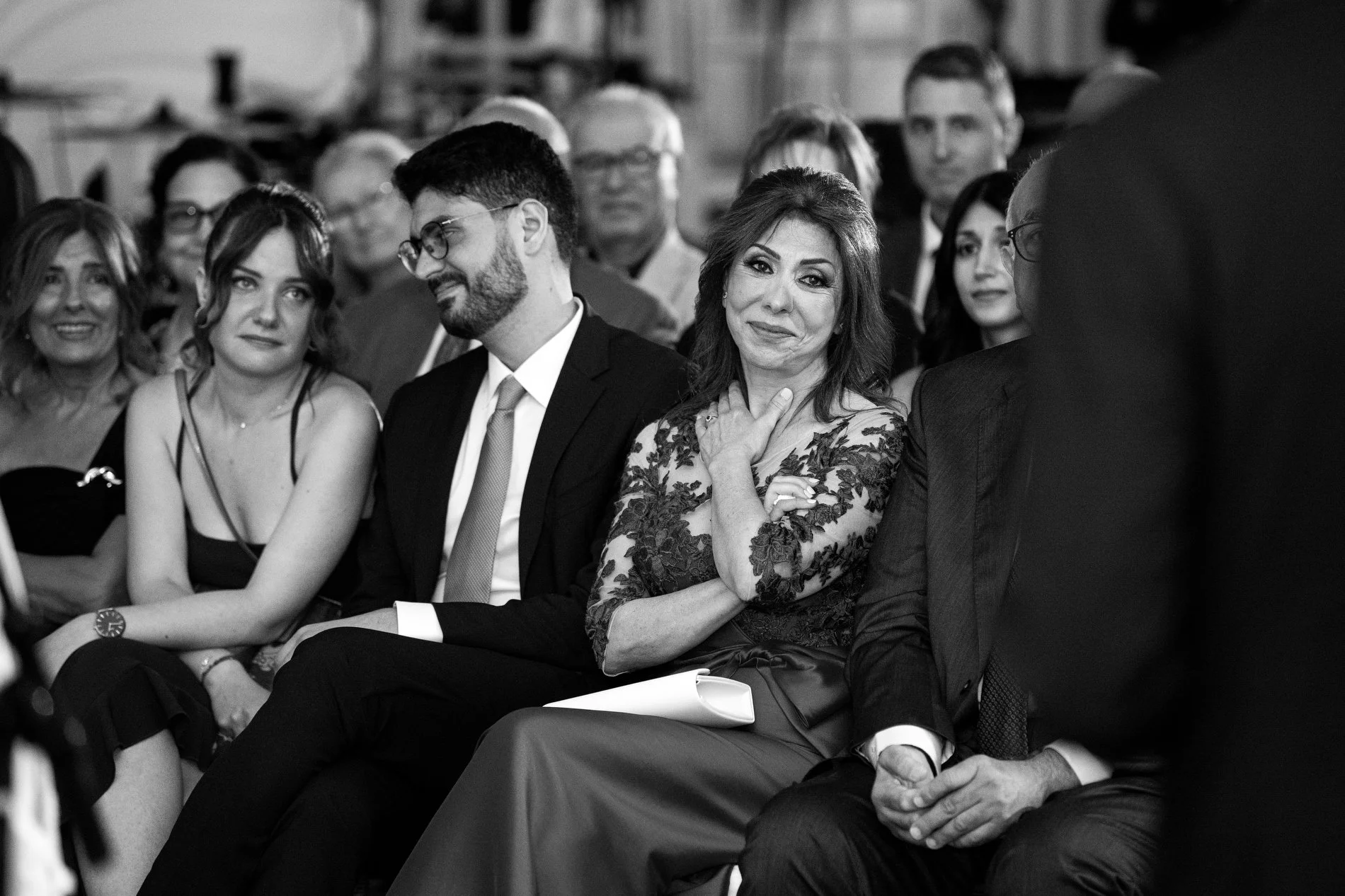 The mother of the groom listens to her son give his vows during a Boston documentary style wedding photography session at Fairmont Copley Plaza Hotel.