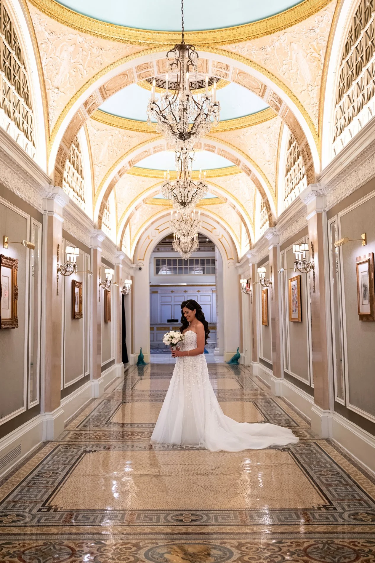 A bride poses for a portrait during her Boston hotel wedding at Fairmont Copley Plaza.