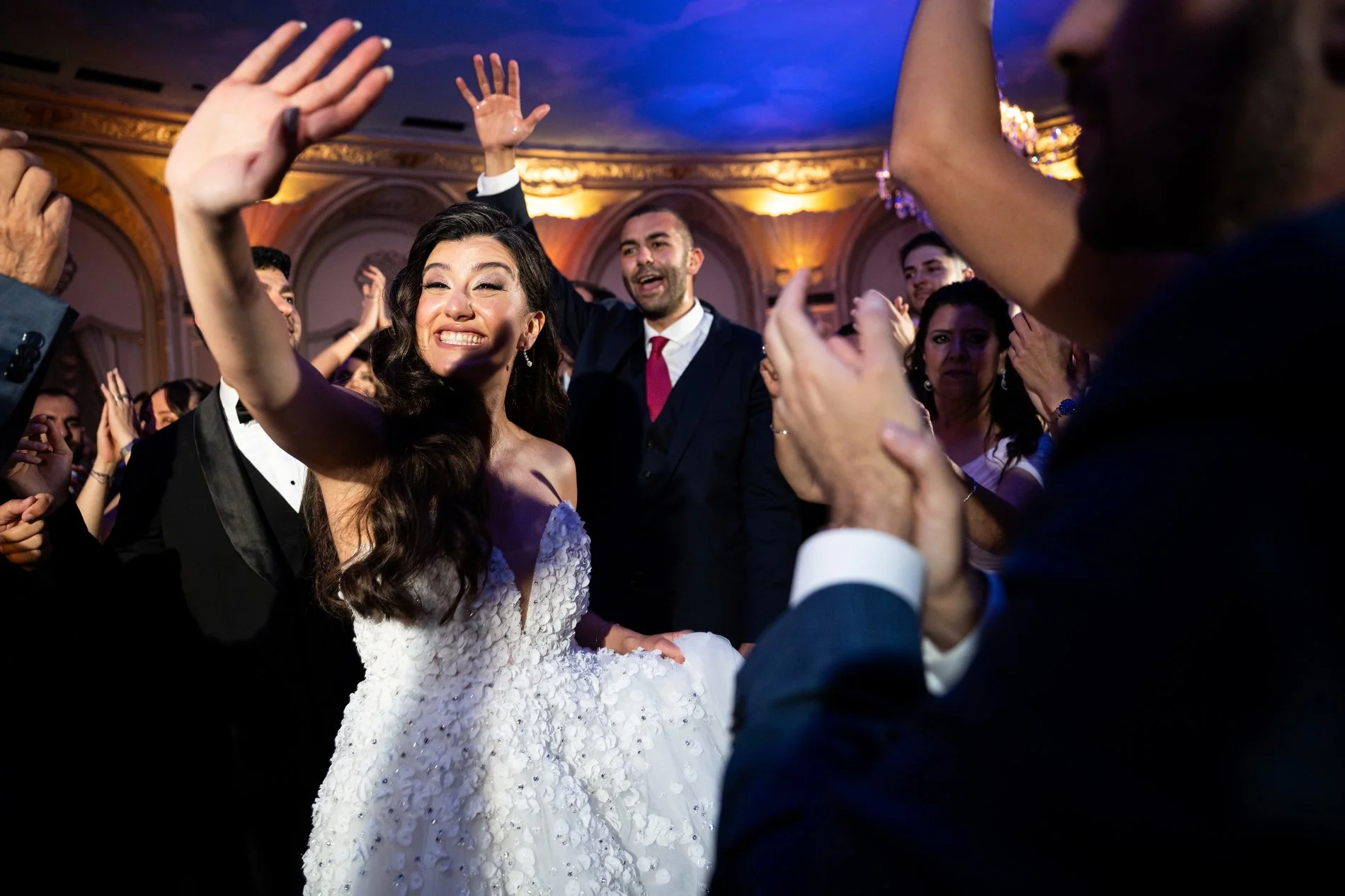 Guests dance during a Boston wedding photojournalism session at Fairmont Copley Plaza Hotel.