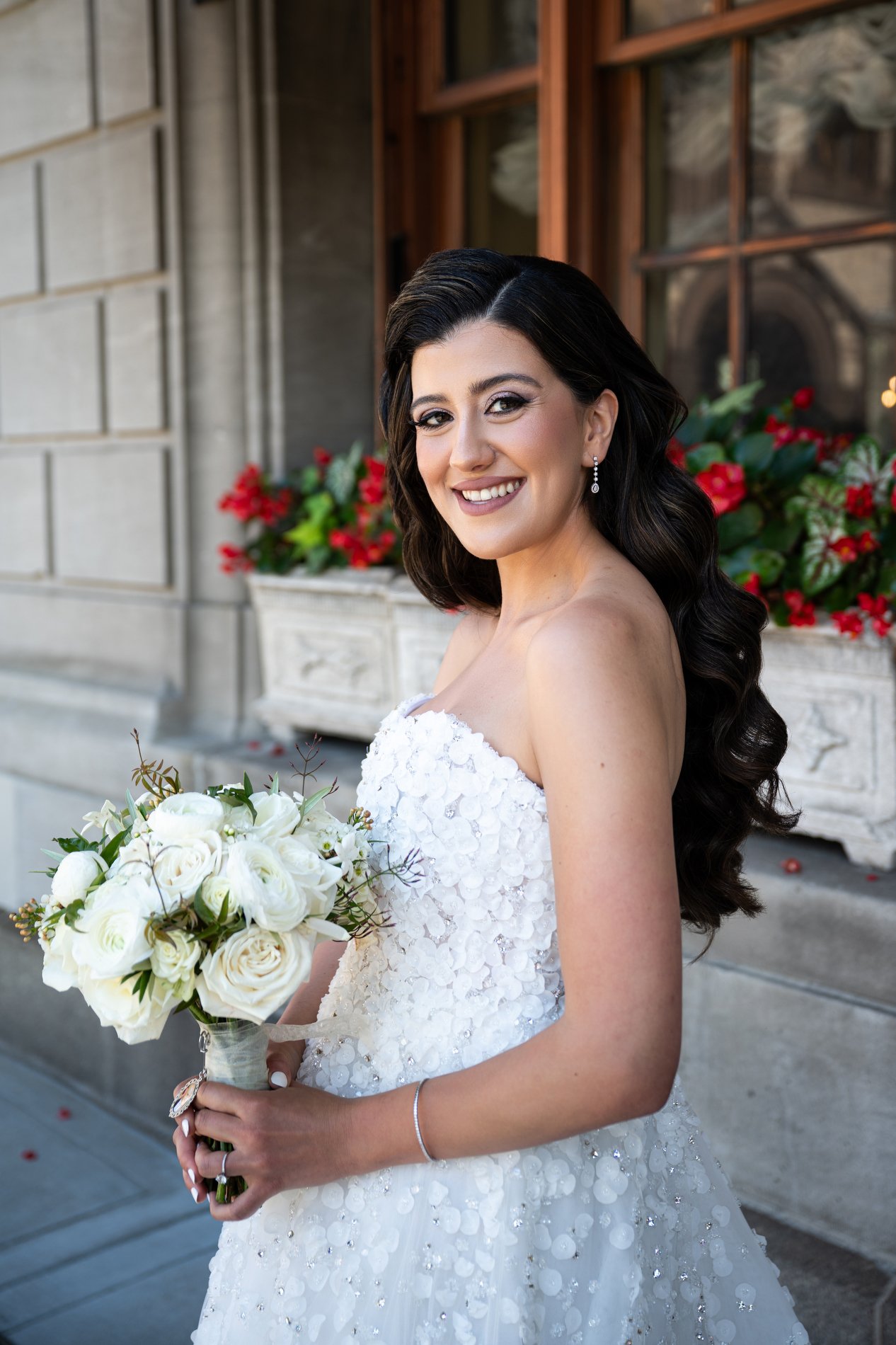 A bride poses for a bridal portrait during her Boston hotel wedding at Fairmont Copley Plaza.