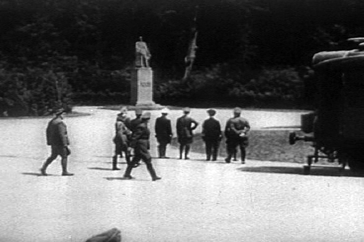 via Wikimedia Commons | A still from Frank Capra's film Divide and Conquer. Hitler (hand on hip) looks at the statue of Foch before the signing of the armistice on 22 June 1940.