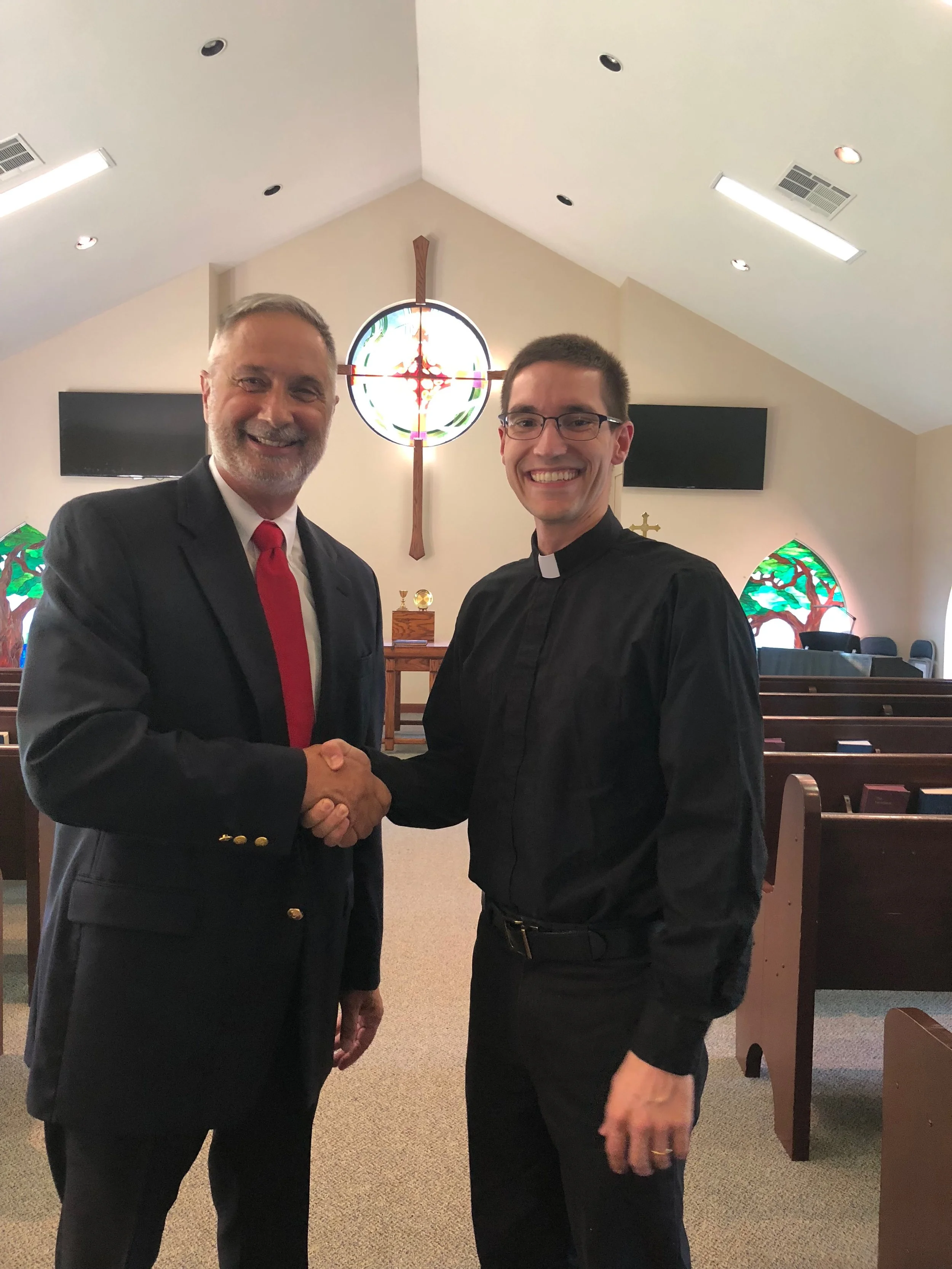 Bob Ogle and Peter Johnston, shaking hands at the completion of the merger!
