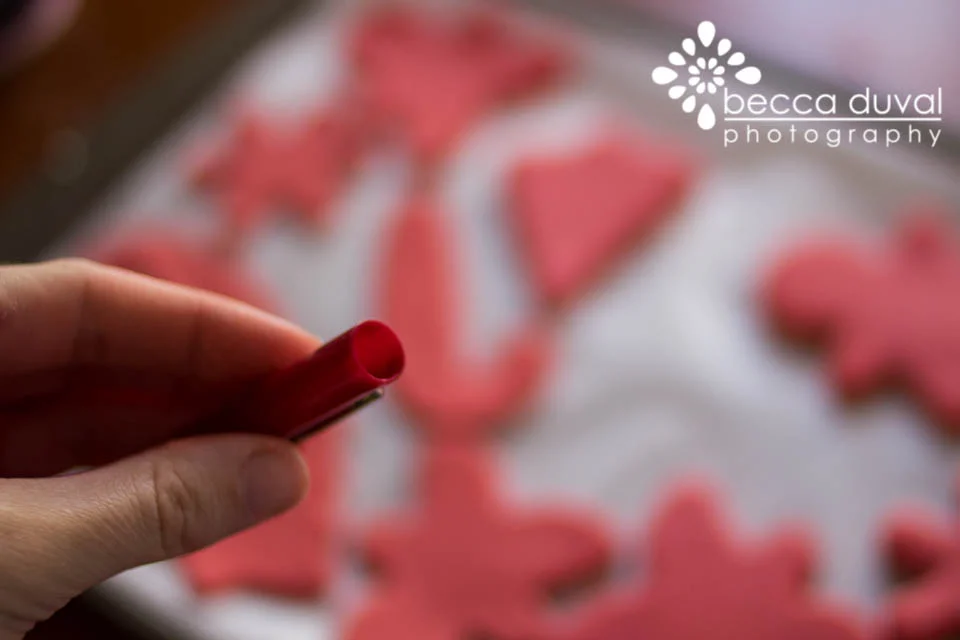 Mom used the cap to a pen to cut out holes. Just keep a toothpick handy to remove the dough from the cap!