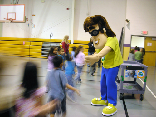  Pictured is Recycling Ben congratulating Dawnville Elementary School students for their recycling efforts that earned them a heavy duty recycling cart last year. 