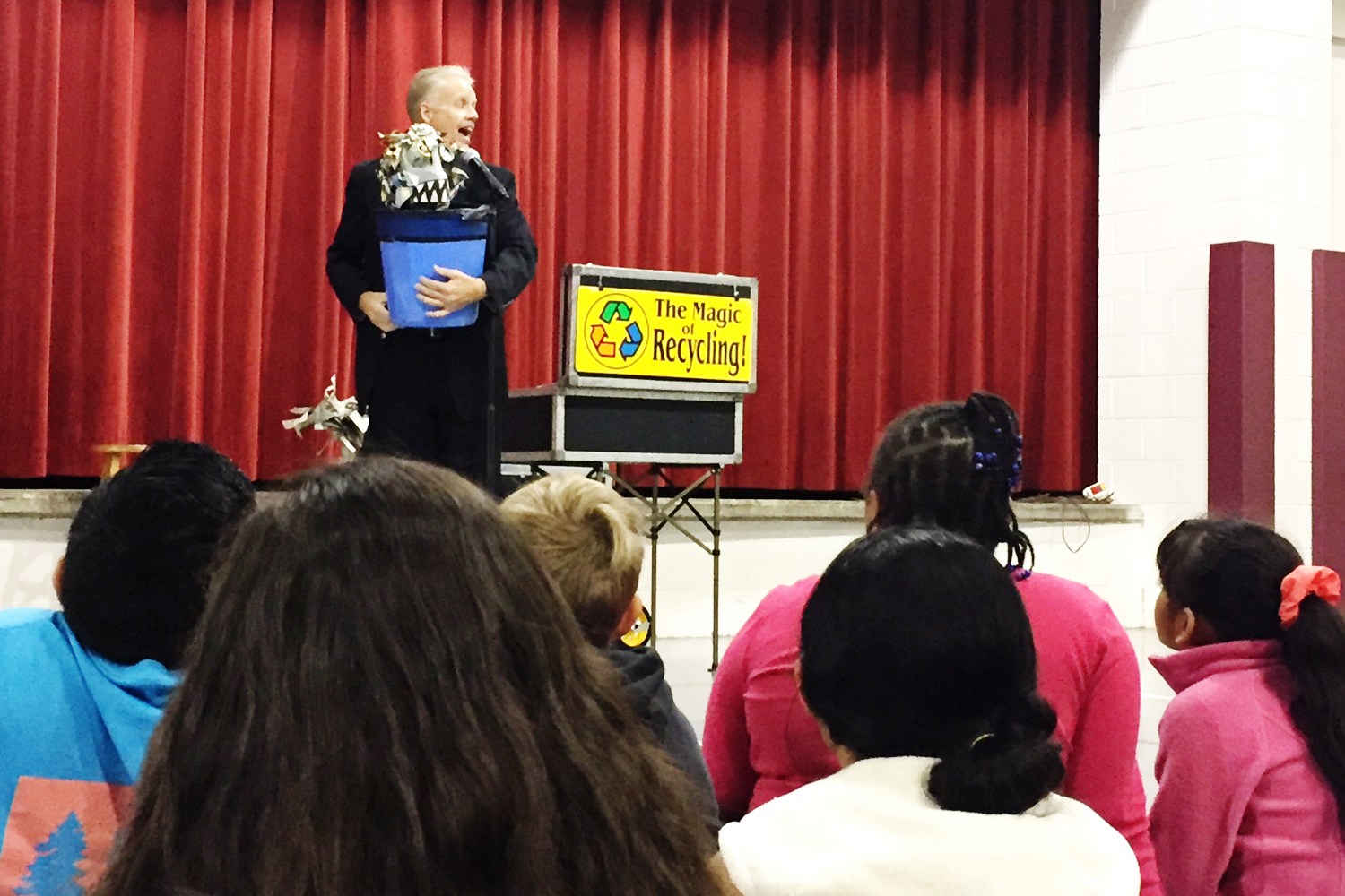 The garbage monster makes a surprise appearance in the trash can held by magician Greg Allen during a special performance of the Magic of Recycling show at Pleasant Grove Elementary School on Friday, November 11.