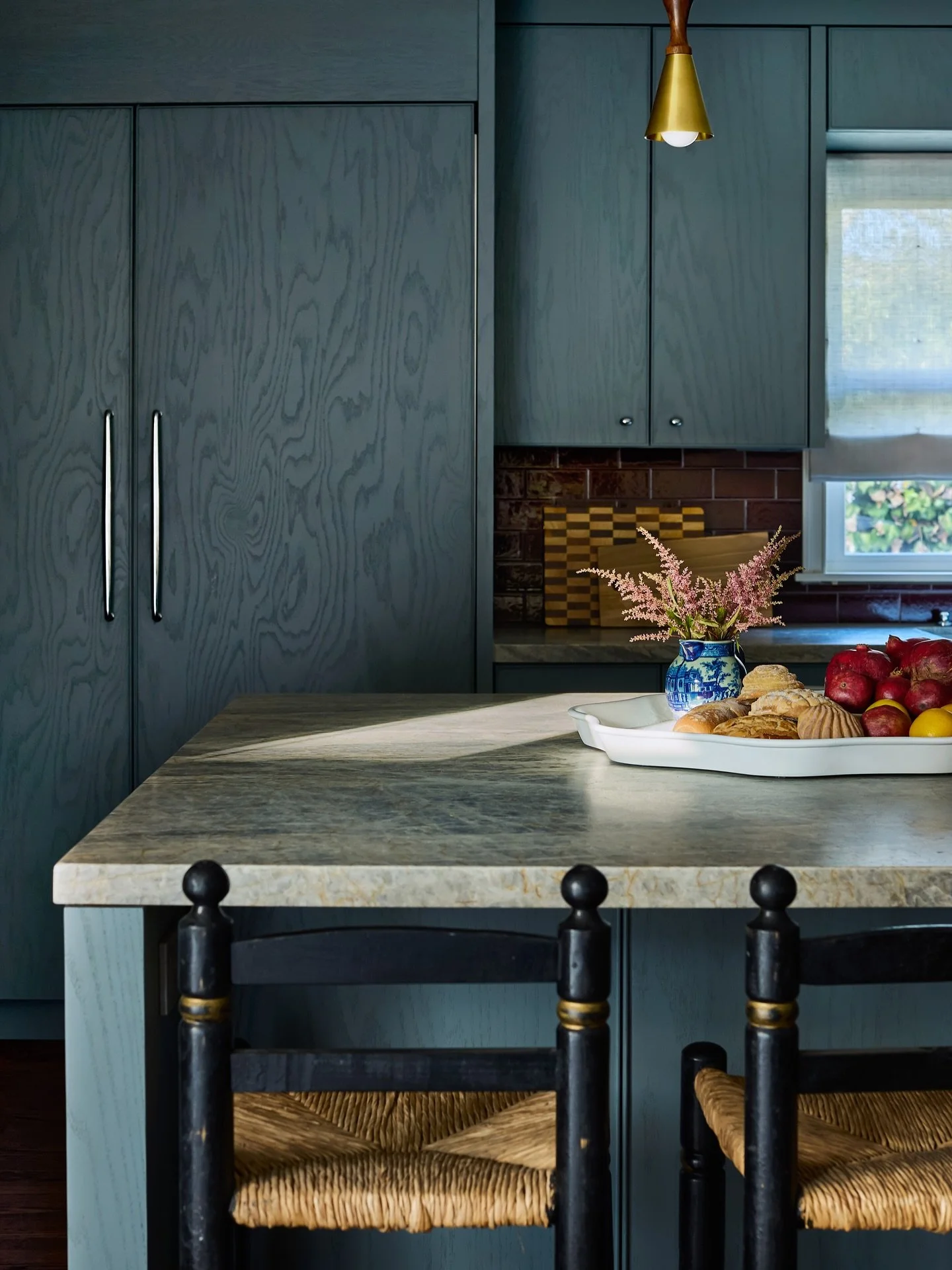 One of my favorite kitchens to date: I love that the client let me do a deep red on the splash and a brighter blue on the cabinets. 

Side note: Been loving this grain forward finish on my custom cabinetry and furnishing. It allows for a fun pop of c