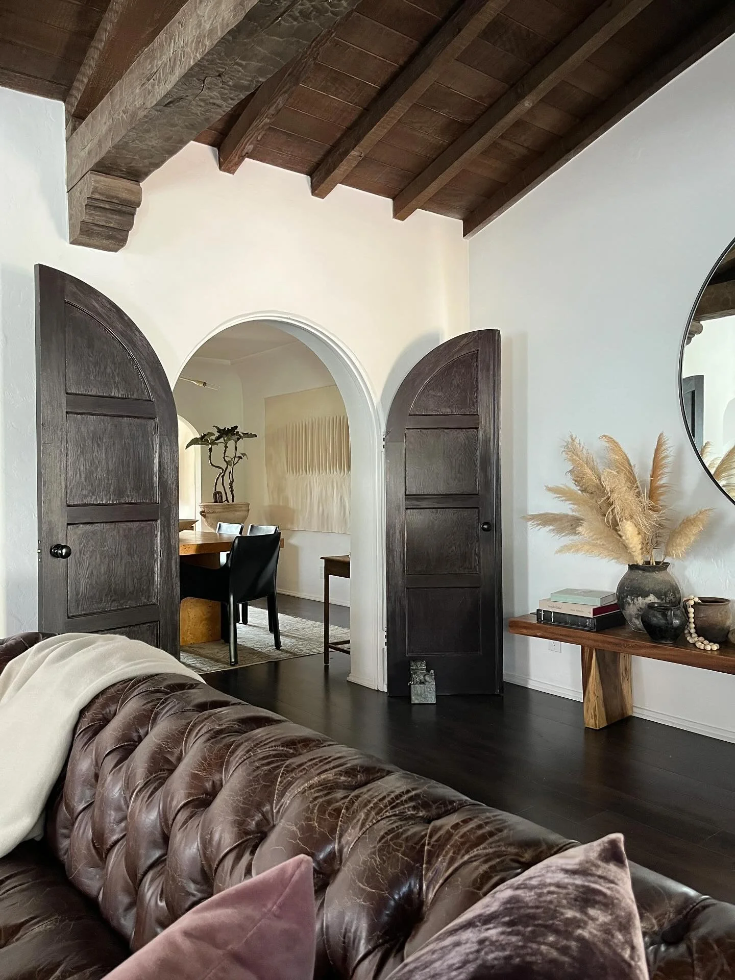 Highlighting the original/intended architectural details is so important to us: the seller of this property had painted the doors a bright cobalt blue&mdash;a bold and interesting choice, but one that distracted from the beautiful original beams of t