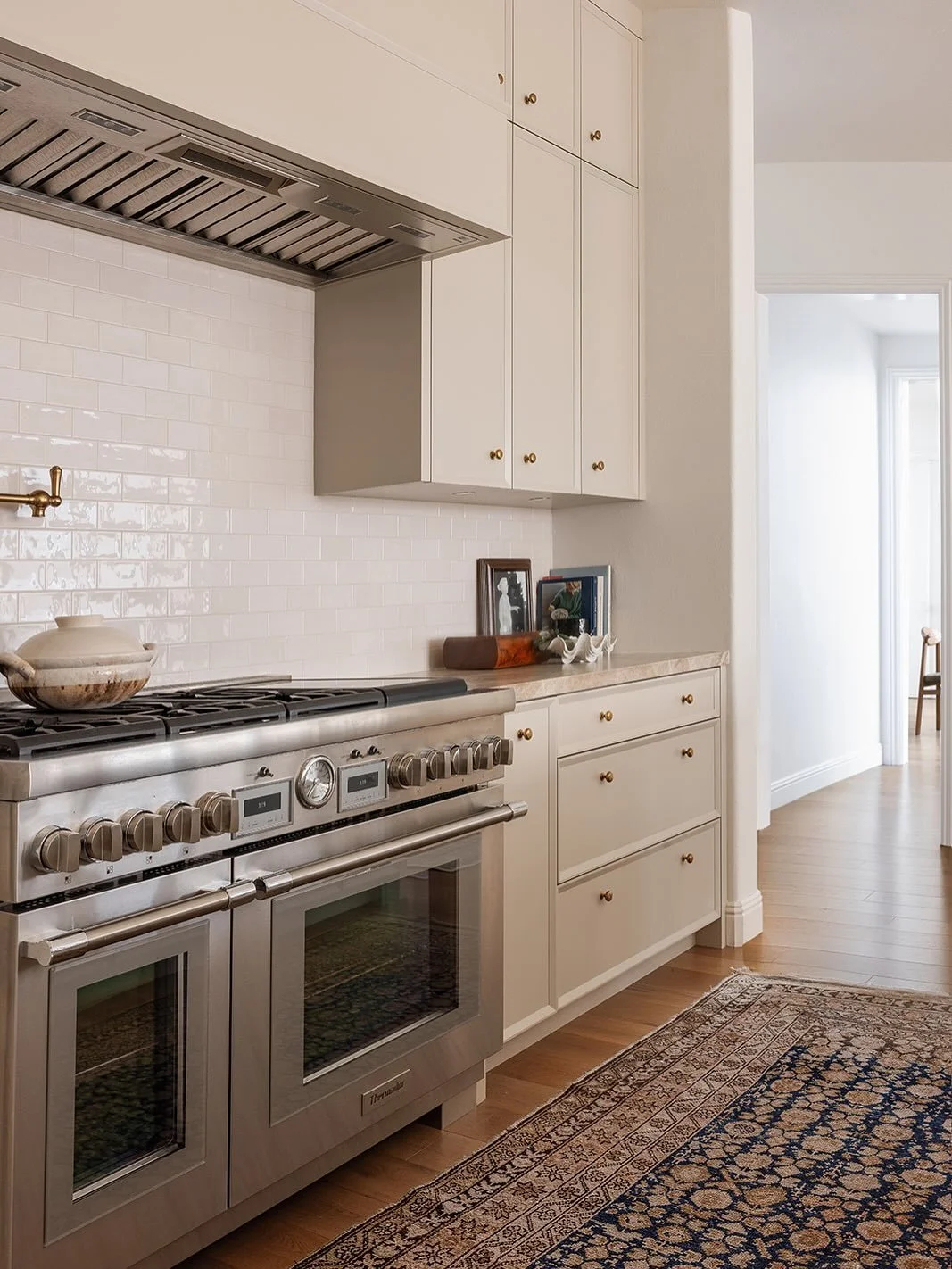 We love a good classic cabinet, but sometimes don&rsquo;t want to lean on a traditional shaker cabinet with the flat &ldquo;picture frame&rdquo; border. For this client&rsquo;s kitchen, we created a custom beveled trim around our custom millwork to a