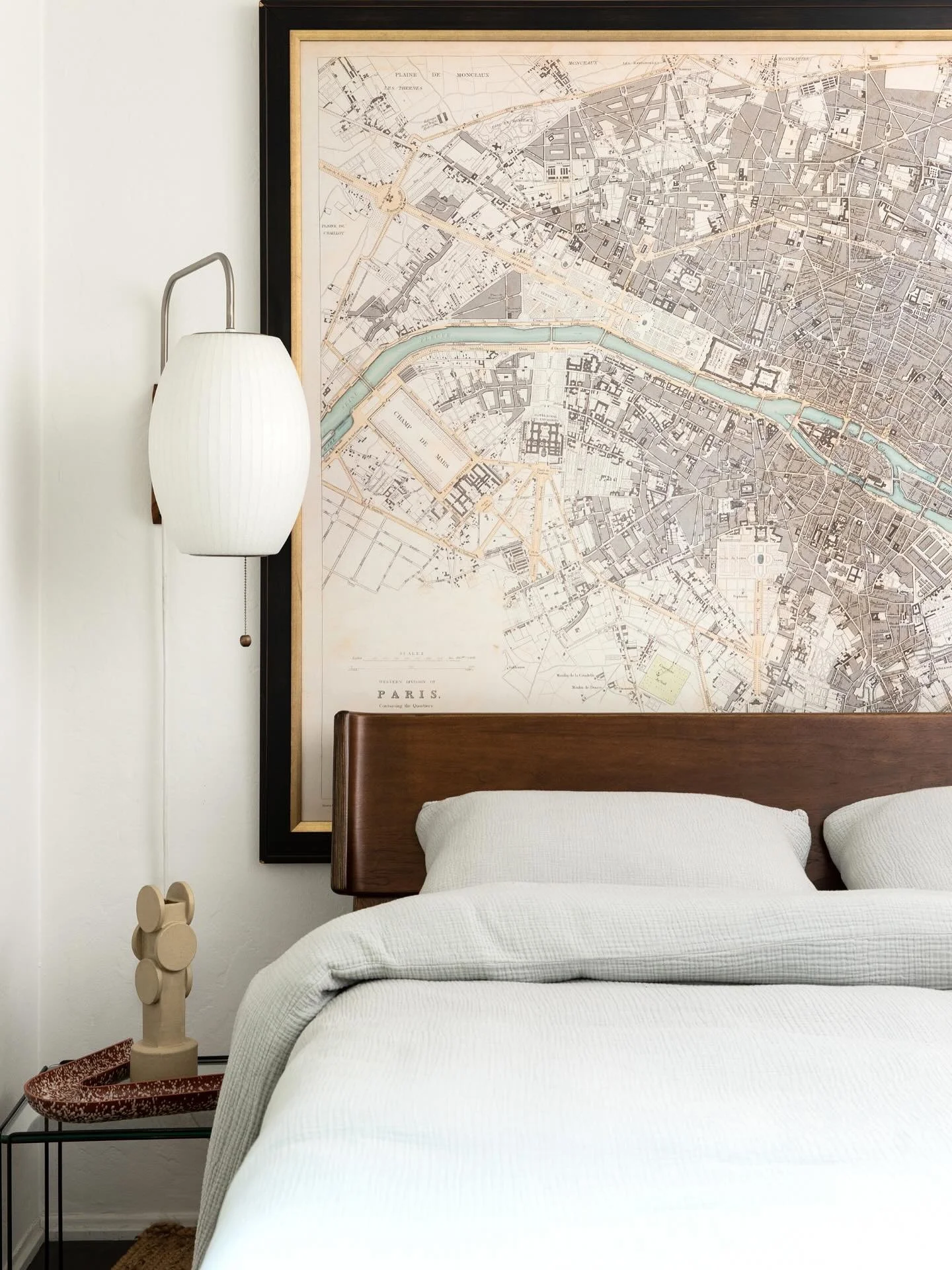 The client&rsquo;s old vintage map anchors their guest bedroom, and we added a George Nielsen lantern sconce to bring in some sculptural contrast. We love creating a dialogue between past and present, old and new. 

Photo | @talktonatasha
