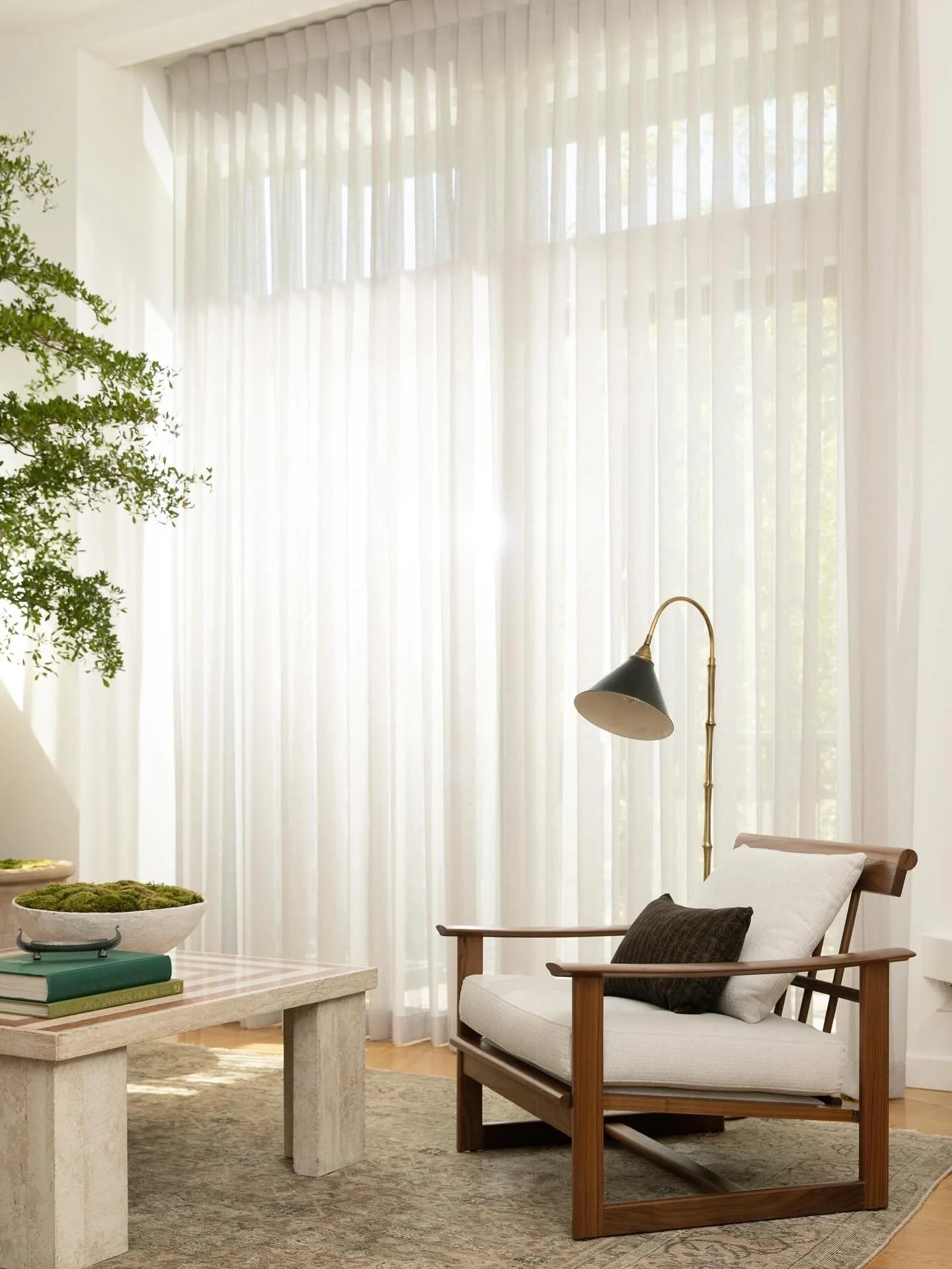 In this Mt. Washington living room, custom drapery softens the contemporary lines of the home and diffuses light in the space.  Our goal was to highlight the 15&rsquo; ceilings while creating warmth and fluidity that would balance the strong architec
