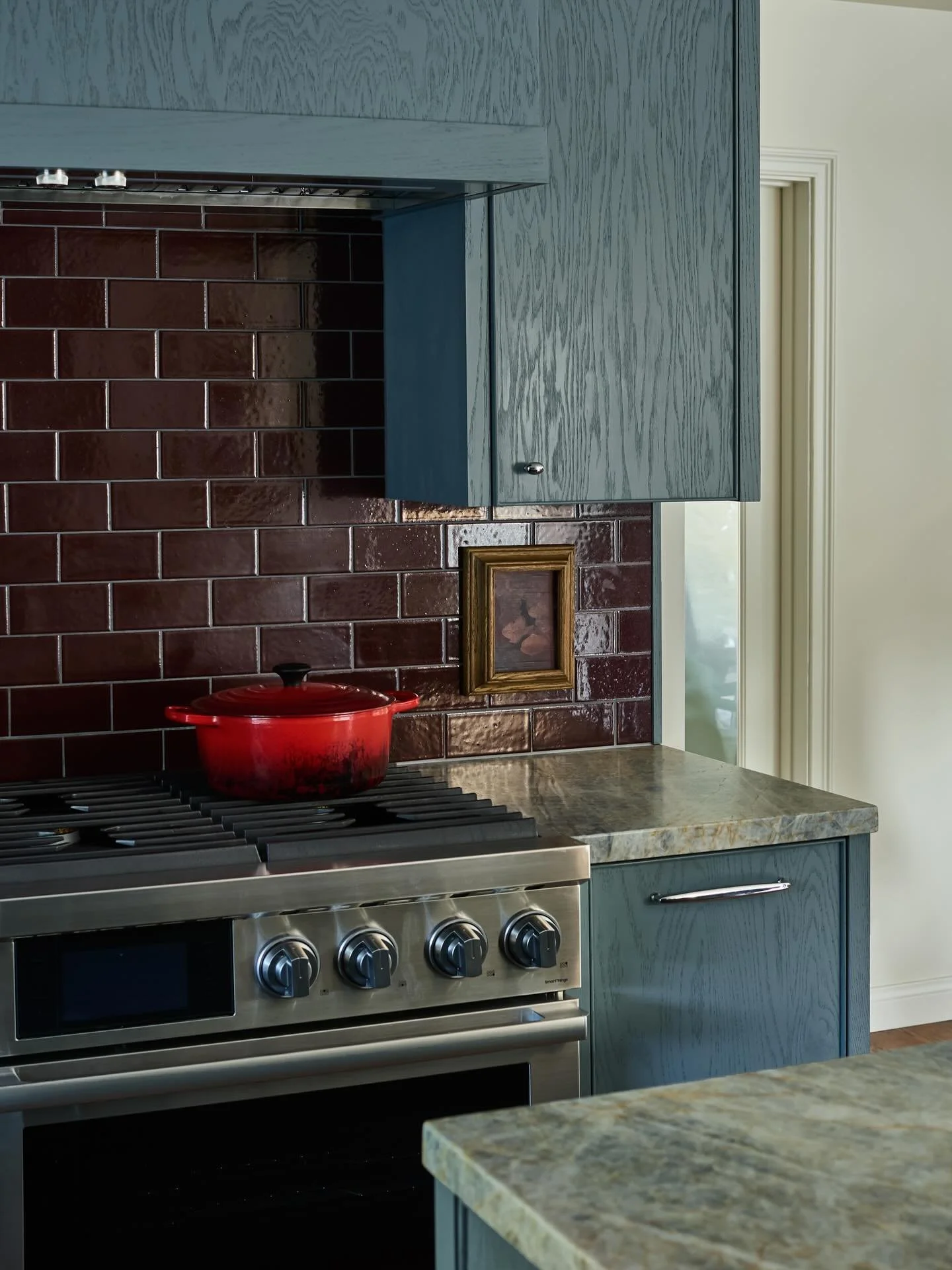Our client&rsquo;s love of bold color meets our love of oxblood. The blue cabinetry and oxblood tile make for a winning combination!

Photo | @slh_studio