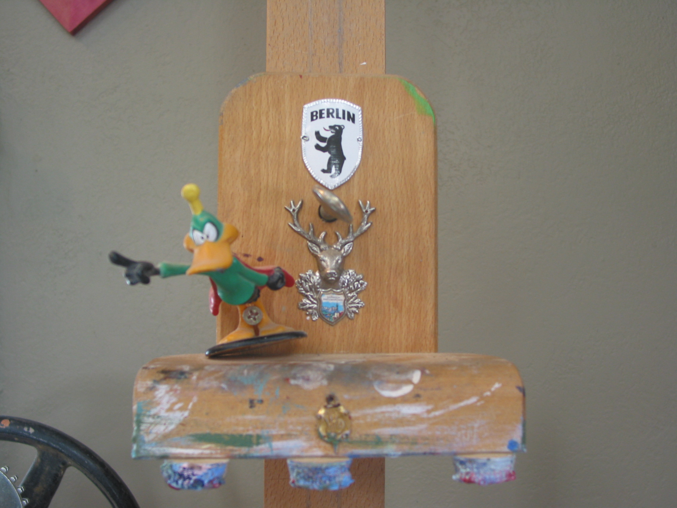The top jaw of my easel is adorned with Daffy as "Stupor Duck" The Berlin Bear shield I got in Berlin visiting Jake and the Garmisch-Partenkirchen Shield I got when we all went to visit Hilary.