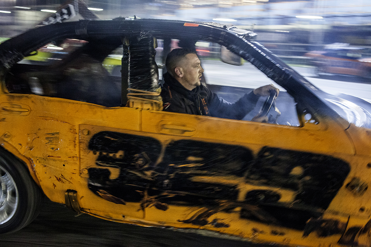 Driver #329, Wayne Wigley, takes to the track post-race after retiring due to a spin out at the exit of turn two during the 2nd heat of the the 3rd round of the Spedeworth National Bangers Championship at Wimbledon Stadium. 26/10/2014.