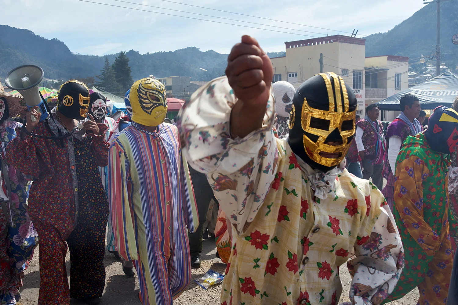 Tzotzil men from Zinacantan dressed up as a cross between a clown and a Luchador arrive in San Sebastian Plaza to perform the Torritos routine. a tradition widespread in different forms through out all of Mexico. In Chiapas the routine holds no ritualistic or religious meaning and is mostly just a form of entertainment for families and children. 2018.