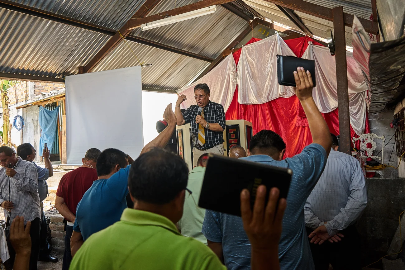  Pastor Saul conducts a sermon during a Culto for Ex addicts and gang members in Mejicanos.  Pastor Saul is an ex gang member and now a man of God who works to rehabilitate active and retired gang members. His home in Soyapango was once an MS-13 Dest