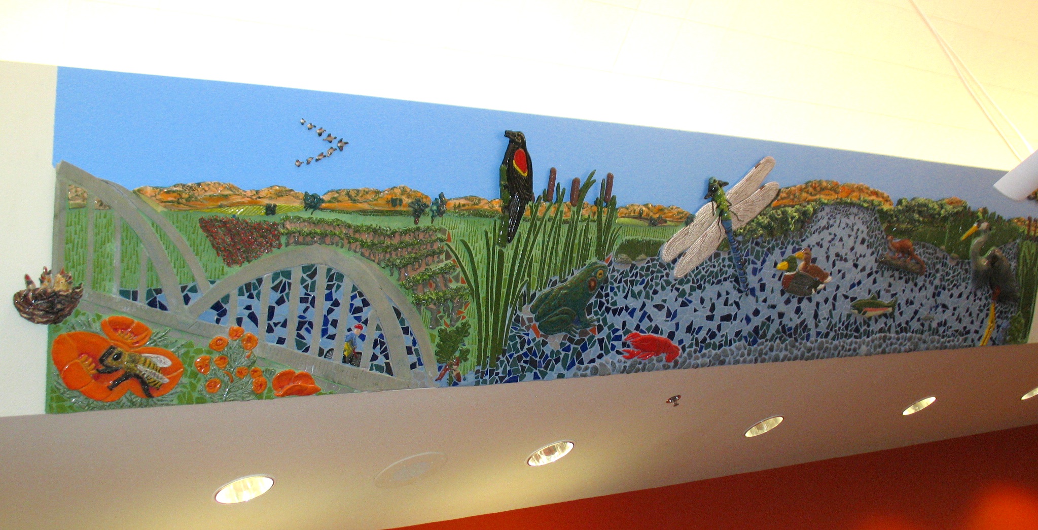  "Tour de Davis: Putah Creek" 3'4"x18' Ceramic relief and tile Located in Children section of Davis Branch of Yolo County Library 