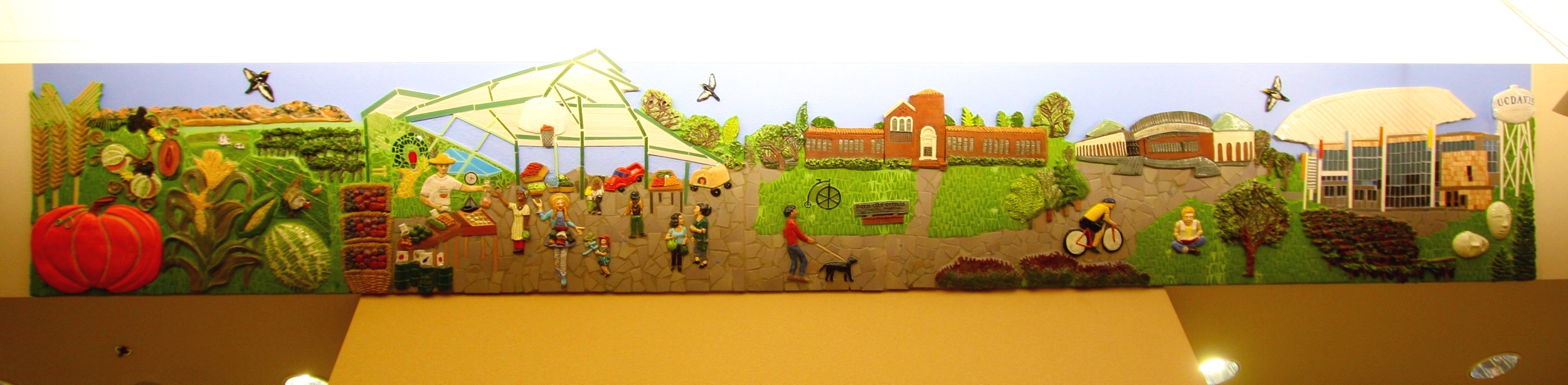  "Tour de Davis: Downtown Davis" 3'4"x20' Ceramic relief and tile Located in Children section of Davis Branch of Yolo County Library 2011 