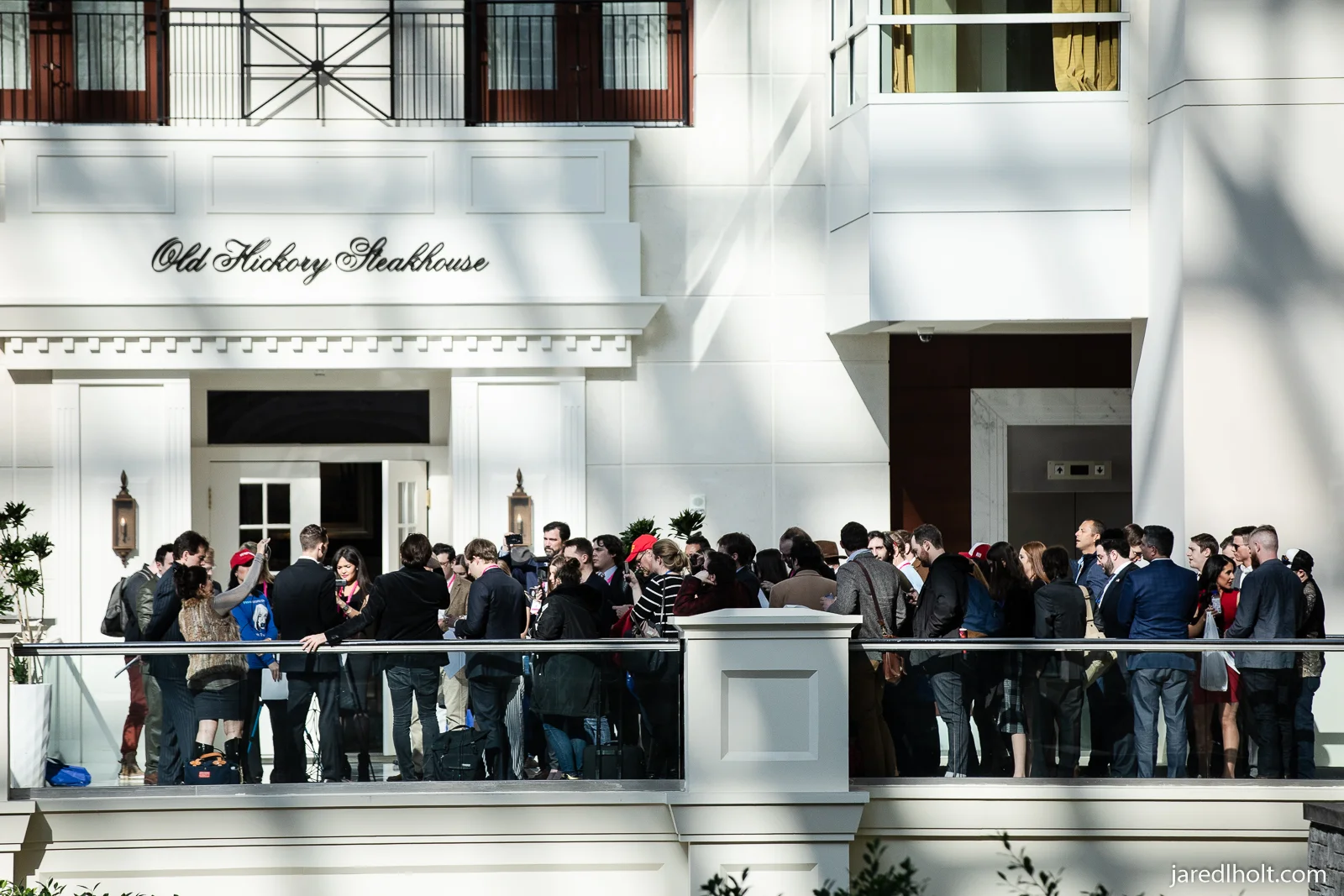 Press gather at a press conference hosted by right-wing conspiracy theorists Jacob Wohl and Laura Loomer