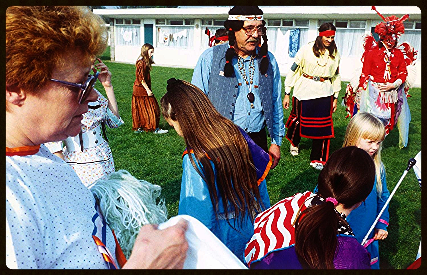 The chief , in red bananer, and his chalet compaions