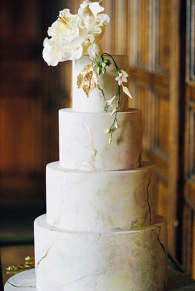 Gold leaf and pealing paint wedding cake