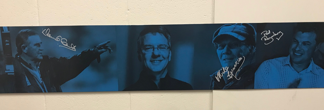 A tribute plaque on 94Fordward’s boardroom wall, From left to right: Coaches David Clark (rugby), Randy Bennett (swimming), Mike Spracklen (rowing) and Paul Regensberg (triathlon).