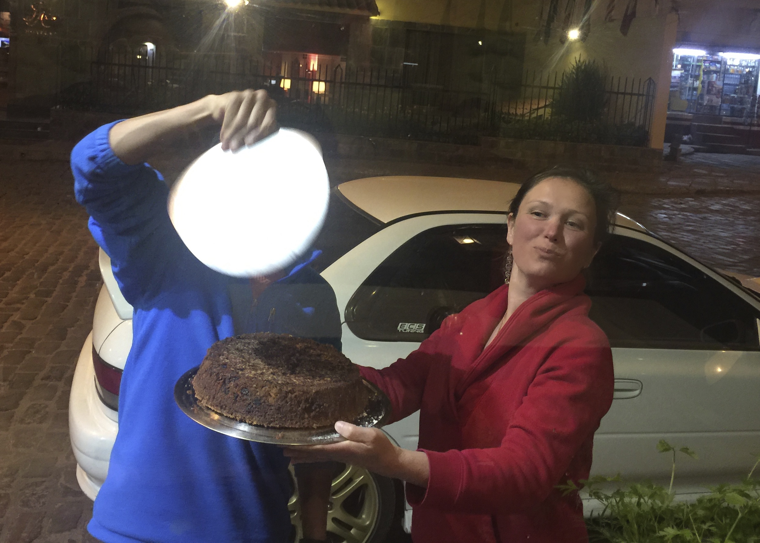 Peter & I cooling the cake outside the restaurant because we were impatient to ice the cake, and then eat it.
