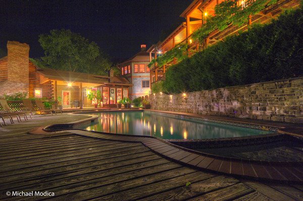 View of the pool & property at night