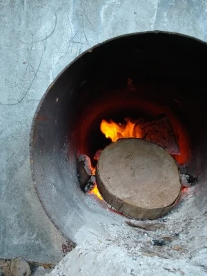 These drying beds have their wood-fire contained in a metal pipe beneath.. so smoke doesn't contaminate the beans.
