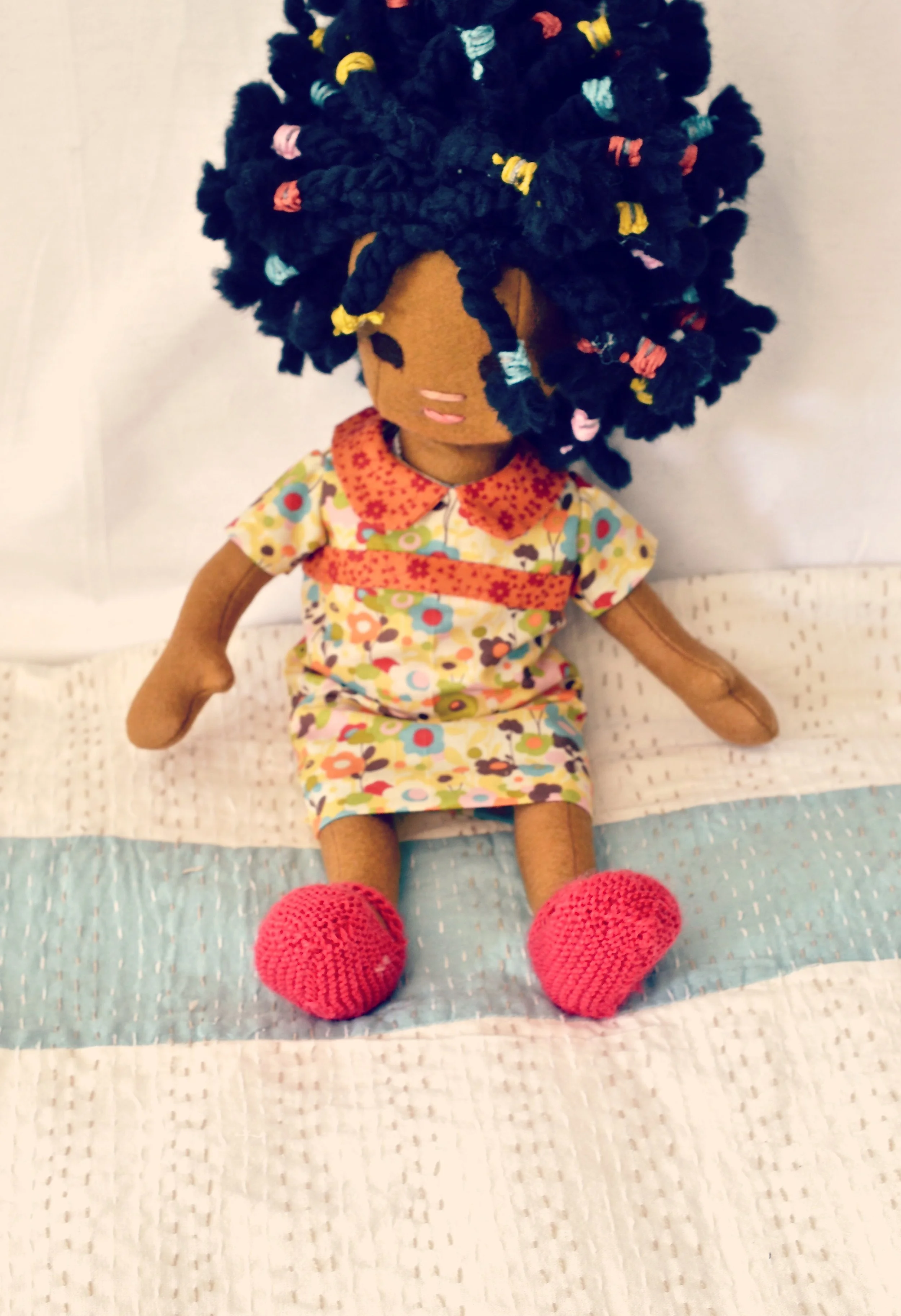 toddler with braids  sitting2.jpg