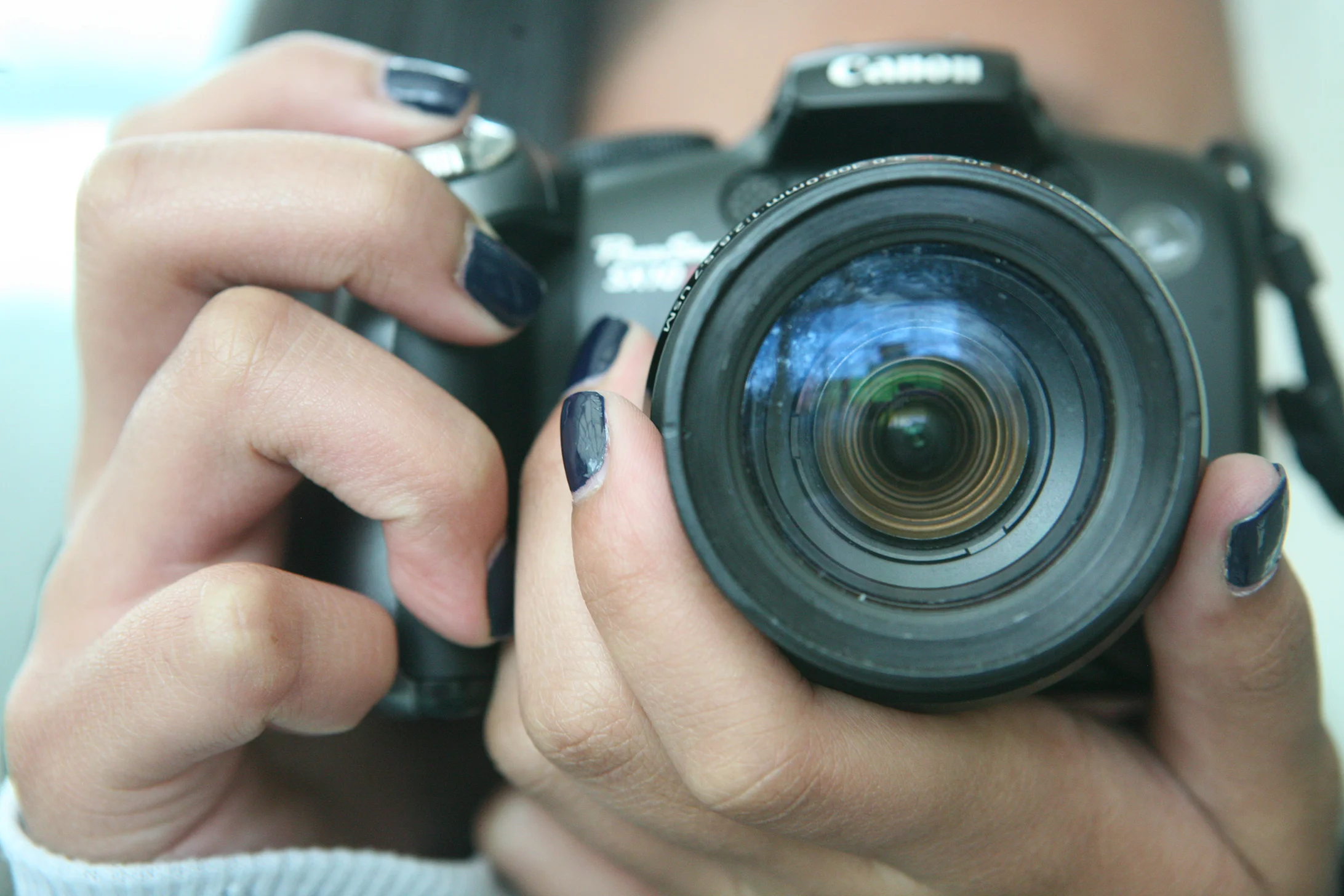  Egg and her current camera, taken by a friend with a Nikon 5D