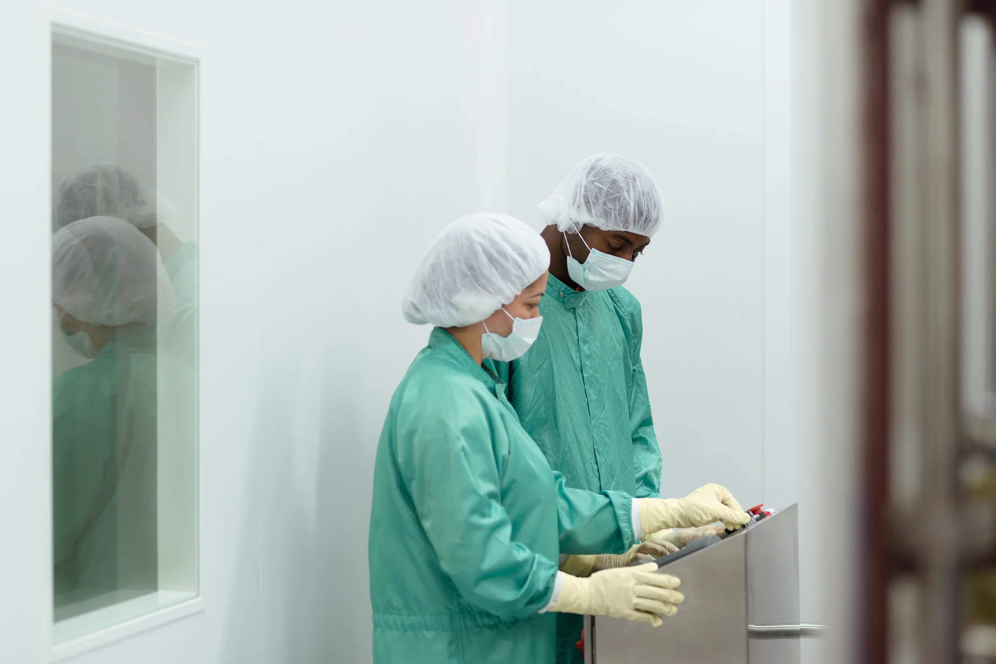 011656965_staff and researchers checking equipment in biotech industry.jpeg