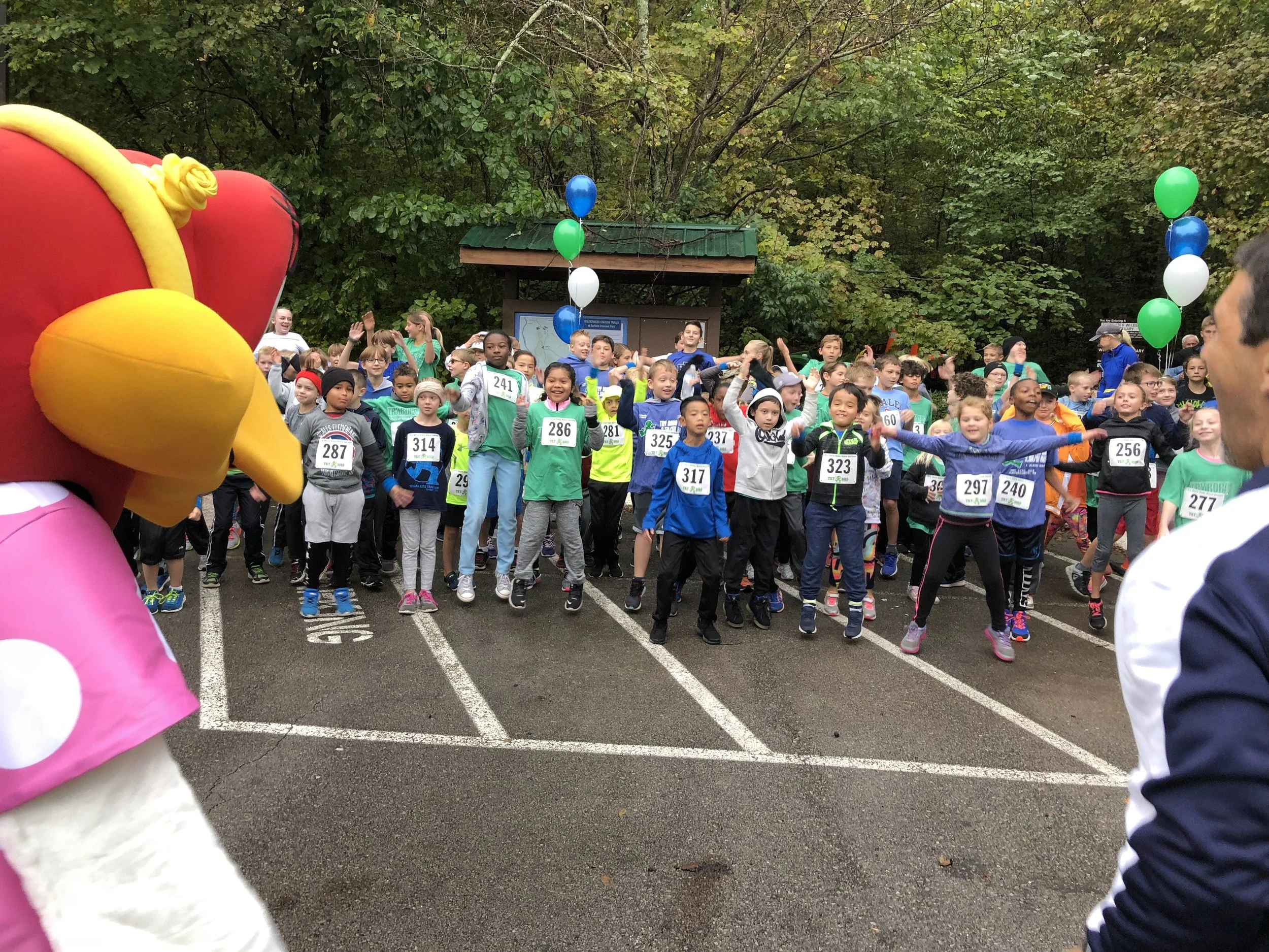 Our race director, Charlie Apigian, and Zuzy from Zaxby’s helps the kids limber up for the race. Thank you Zaxby’s.